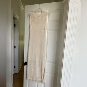 Ivory/cream sweater dress with fringe on bottom and slips on both sides